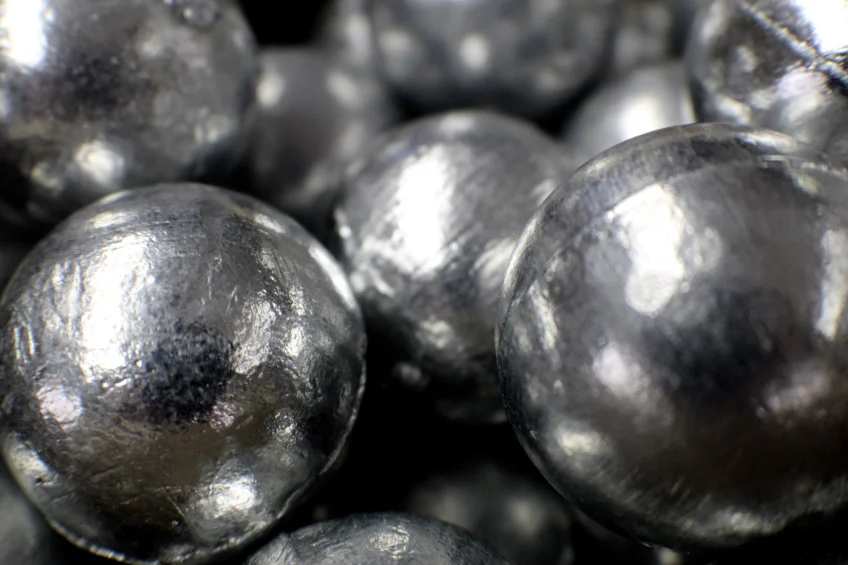 Close-up of shiny zinc metal balls