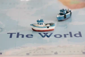 Small ships on a world map representing global trade